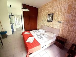 Postel nebo postele na pokoji v ubytování HOLIDAYS STUDIOS & APARTMENTS