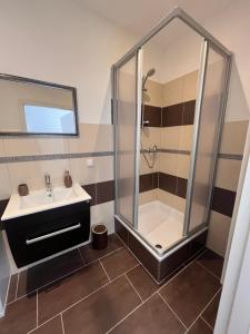 a bathroom with a shower and a sink at Apartment Södderich 1 in Waake