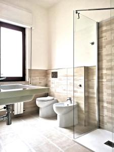 a bathroom with a sink and a toilet and a shower at Casa Spada in Pula