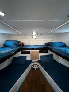 a boat with two beds and a table in it at Morgana in Ain Sokhna