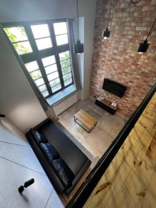 Televízia a/alebo spoločenská miestnosť v ubytovaní Property Apart - plac Jana Pawla II Centrum