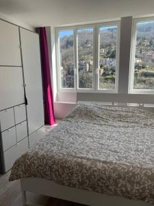 Cama o camas de una habitación en Loft moderne au cœur de l’Auvergne