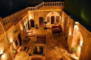 an overhead view of a courtyard in a building with a fountain at karagül otel in Sanlıurfa