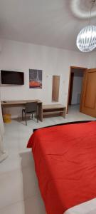 Televízia a/alebo spoločenská miestnosť v ubytovaní B&b del corso + 8 fotografií