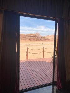 a door to a room with a view of the desert at Rum Stars Camp in Wadi Rum