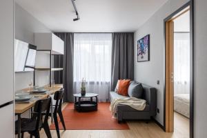 a small apartment with a kitchen and a living room at Balcia Residence in Riga