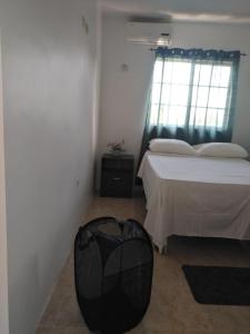 a bedroom with a bed and a bag on the floor at Splendid Sensation in Florence Hall
