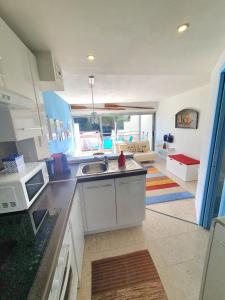 a kitchen with a sink and a counter top at SEA SIDE in Mandelieu-La Napoule