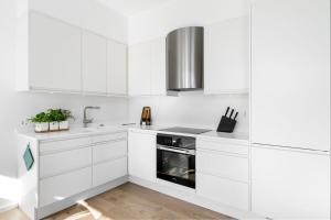 Kuchyň nebo kuchyňský kout v ubytování Eksklusiv leilighet på Skjoldnes