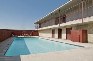 a large swimming pool in front of a building at Americas Best Value Inn Midlothian in Midlothian