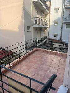 a balcony of a building with a railing at Two bedroom apartment in Historical area in Thessaloniki