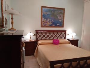 Tempat tidur dalam kamar di Villa Mariella
