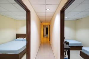 Postel nebo postele na pokoji v ubytování CLP perai homstay in perai