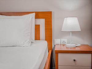 Postel nebo postele na pokoji v ubytování Aljur Hotel