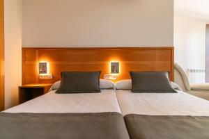 Posteľ alebo postele v izbe v ubytovaní Aparthotel Cal Marçal