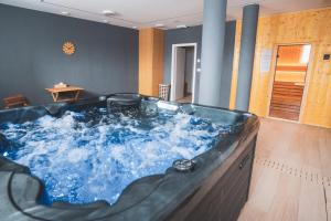 a large jacuzzi tub in a room at Apartmán Vila Zuberec in Zuberec