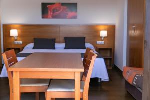 Posteľ alebo postele v izbe v ubytovaní Aparthotel Cal Marçal