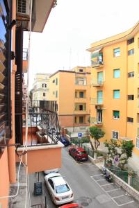 a view of a street from a balcony of a building at Brillante Appartamento di Sara -Daniele Case Vacanza in Anzio