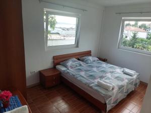 Postel nebo postele na pokoji v ubytování APARTMENT RAFAELLO