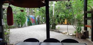 a view of a street with graffiti on the wall at Aldeia Itamambuca Chalé Camping Ubatuba in Ubatuba +9 photos