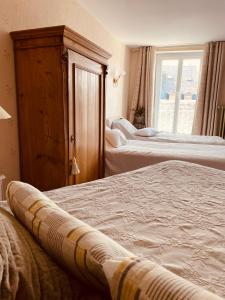 Katil atau katil-katil dalam bilik di Hotel de la Sologne
