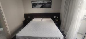 Säng eller sängar i ett rum på Apartamento San Diego Pampulha Propriedade Particular
