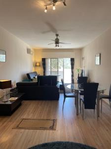 a living room with a couch and a table at Belleview Heights in Limassol