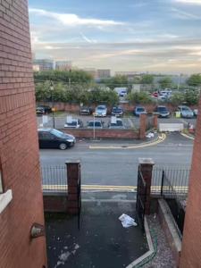 a view of a parking lot from a building at Extra large 6 bed 7 bath townhouse in Manchester in Manchester