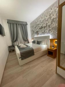 Postel nebo postele na pokoji v ubytování Roma dei Papi B&B