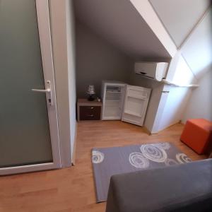 a small room with a staircase with an attic at EL Mar Sole in Eforie Sud +16 photos