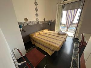 Ένα ή περισσότερα κρεβάτια σε δωμάτιο στο Piccolo Hotel di Lavagna