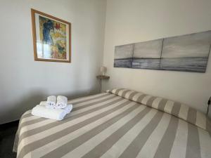 Ένα ή περισσότερα κρεβάτια σε δωμάτιο στο Piccolo Hotel di Lavagna