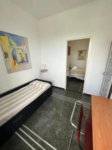 Ένα ή περισσότερα κρεβάτια σε δωμάτιο στο Piccolo Hotel di Lavagna