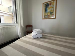 Ένα ή περισσότερα κρεβάτια σε δωμάτιο στο Piccolo Hotel di Lavagna