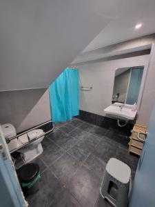 a bathroom with a sink and a mirror at Central Hostel in Athens