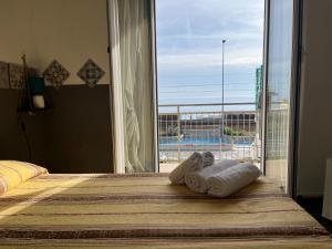 Ένα ή περισσότερα κρεβάτια σε δωμάτιο στο Piccolo Hotel di Lavagna