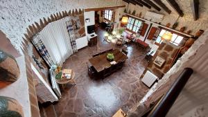 an overhead view of a living room with tables and chairs at Rural Kairós "Un espacio con alma" in Siete Aguas