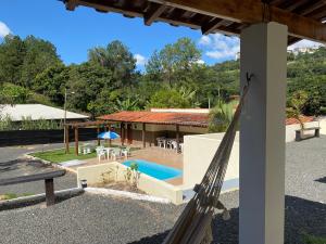 a view of a house with a swimming pool at Pousada Saint James in Águas de Lindoia