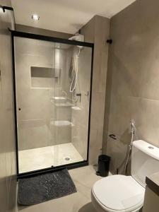 a bathroom with a shower and a toilet at Studio da fonte/Vista mar in Salvador