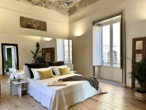 Ένα ή περισσότερα κρεβάτια σε δωμάτιο στο Casa Guilla_alla Cattedrale