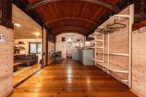 a hallway of a tiny house with a wooden ceiling at Lisa's Farm Place in Rishon LeẔiyyon