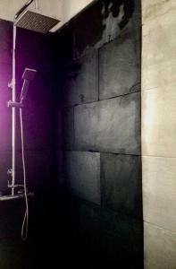a bathroom with a shower with a wall at LA CARACOLA Benicarló in Benicarló +19 photos