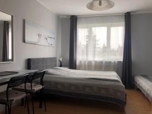 Кровать или кровати в номере Noclegi Gdańsk Pokoje Gościnne