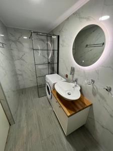 a bathroom with a sink and a mirror at CARA Creta Beach House in Kolymvari