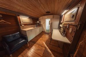 an interior view of a kitchen in a tiny house at Lisa's Farm Place in Rishon LeẔiyyon