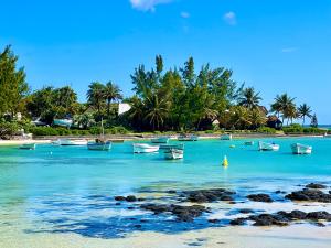 a group of boats in the water on a beach at Villa Hacienda 4 in Cap Malheureux