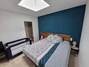 Posteľ alebo postele v izbe v ubytovaní Gîte Le Saint Benoît
