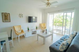 a living room with a couch and a table at Apartment in Dominicus in Bayahibe