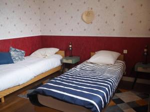 Giường trong phòng chung tại Gîte Location des 4 saisons