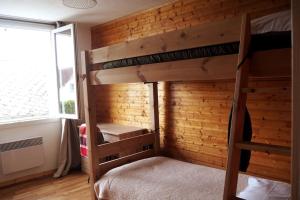 Giường trong phòng chung tại Gîte Location des 4 saisons